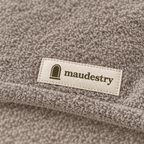 Close-up of the terry and woven Maudestry label