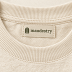Close-up of the ribbed collar and woven Maudestry label