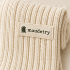 Close-up of the ribbed cuff and woven Maudestry label